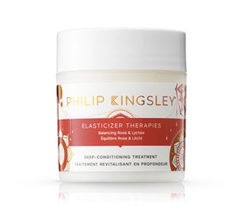 A tub of Philip Kingsley's Elasticizer therapies in balancing rose and lychees, the best leave in conditioner for curly hair.